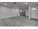 Bright living room featuring updated flooring, fresh paint, and modern lighting at 4432 Ash Ave, Las Vegas, NV 89110