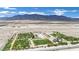 Vast aerial image showcasing a plant Bedroom against a mountain backdrop with a blue sky above at 4909 Cherokee Run Ct, Las Vegas, NV 89131