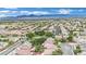 High angle aerial view of a residential neighborhood with tree lined street with mountains in background at 4909 Cherokee Run Ct, Las Vegas, NV 89131