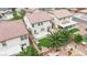 Aerial view of a fenced backyard with a patio, artificial turf, and landscaped garden at 4909 Cherokee Run Ct, Las Vegas, NV 89131