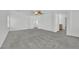 Bedroom featuring neutral carpet, white walls, a ceiling fan, with an open door to the hallway at 4909 Cherokee Run Ct, Las Vegas, NV 89131