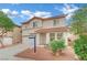 Charming two-story home featuring a terra cotta roof, low maintenance landscaping and a two car garage at 4909 Cherokee Run Ct, Las Vegas, NV 89131