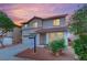 Charming two-story home with a stucco exterior, tile roof, and manicured yard at 4909 Cherokee Run Ct, Las Vegas, NV 89131