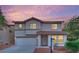 Charming two-story home with a stucco exterior, tile roof, and well-maintained landscaping at 4909 Cherokee Run Ct, Las Vegas, NV 89131