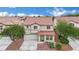 Charming two-story home with a tile roof, manicured landscaping, a driveway, and a two-car garage at 4909 Cherokee Run Ct, Las Vegas, NV 89131