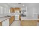 Updated kitchen featuring stainless steel refrigerator and white oven and dishwasher at 4909 Cherokee Run Ct, Las Vegas, NV 89131