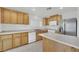 Updated kitchen featuring stainless appliances, a center island, and plenty of counter space at 4909 Cherokee Run Ct, Las Vegas, NV 89131