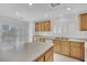 Bright kitchen with stainless steel sink, white appliances, and light wood cabinets overlooking the backyard at 4909 Cherokee Run Ct, Las Vegas, NV 89131