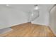 Empty living room with hardwood floors, a staircase, and light walls at 4909 Cherokee Run Ct, Las Vegas, NV 89131