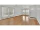 Empty living room featuring hardwood floors, natural light and a front door at 4909 Cherokee Run Ct, Las Vegas, NV 89131
