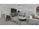 Cozy living room with plush seating and lots of natural light at 4909 Cherokee Run Ct, Las Vegas, NV 89131