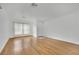 Empty living room with hardwood floors, light walls and front door at 4909 Cherokee Run Ct, Las Vegas, NV 89131