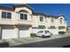 Charming townhouse featuring multiple units with garages and manicured landscaping at 4941 Black Bear Rd # 202, Las Vegas, NV 89149