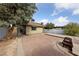 A spacious backyard has a seating area and fire pit with mature landscaping at 504 Crony Ave, Henderson, NV 89011