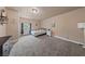 Spacious primary bedroom featuring cozy carpeting and lots of natural light at 504 Crony Ave, Henderson, NV 89011