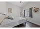 Cozy bedroom featuring wood floors, natural light, and modern decor at 504 Crony Ave, Henderson, NV 89011