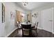 A cozy dining area with natural light, wood floors, and modern decor at 504 Crony Ave, Henderson, NV 89011