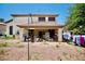 Backyard view showcasing covered patio and a large, open area at 5412 Rainbows End Dr, Las Vegas, NV 89149