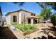 A large backyard with a covered patio, a vegetable garden, and plenty of space for outdoor activities at 5412 Rainbows End Dr, Las Vegas, NV 89149