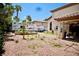 A spacious backyard includes a garden bed and area for recreational vehicles at 5412 Rainbows End Dr, Las Vegas, NV 89149