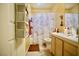 A functional bathroom featuring a marble shower curtain and standard fixtures at 5412 Rainbows End Dr, Las Vegas, NV 89149