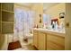 Standard bathroom featuring a tub/shower combo, single sink vanity, and neutral wall color at 5412 Rainbows End Dr, Las Vegas, NV 89149