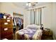 Bedroom featuring a bed, dresser, and closet with clothes at 5412 Rainbows End Dr, Las Vegas, NV 89149