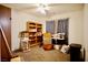 Bedroom with ceiling fan, neutral carpet, and natural light at 5412 Rainbows End Dr, Las Vegas, NV 89149