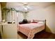 A cozy bedroom featuring a ceiling fan, neutral walls, and a comfortable bed at 5412 Rainbows End Dr, Las Vegas, NV 89149