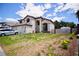 Attractive two-story home featuring a large front yard with flowering bushes, great curb appeal at 5412 Rainbows End Dr, Las Vegas, NV 89149