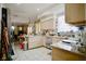 Bright kitchen boasts tile floors, countertops, and ample cabinet space at 5412 Rainbows End Dr, Las Vegas, NV 89149