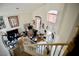 View from the top of the staircase of a loft space with a vaulted ceiling and large window at 5412 Rainbows End Dr, Las Vegas, NV 89149