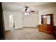 Spacious main bedroom showcasing neutral carpet and double closets at 5412 Rainbows End Dr, Las Vegas, NV 89149