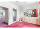 Spacious bathroom with a large vanity, pink toilet, and an adjacent shower at 56 Quail Run Rd, Henderson, NV 89014