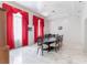 Formal dining room with marble floors, large table, and ornate window coverings at 56 Quail Run Rd, Henderson, NV 89014