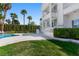 Beautiful backyard featuring a pool, lawn, and grand two-story home at 56 Quail Run Rd, Henderson, NV 89014