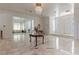 Grand foyer with marble floors, elegant chandelier, and ornate double doors at 56 Quail Run Rd, Henderson, NV 89014