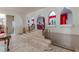 Elegant foyer with marble floors, staircase with brass railing, and arched openings at 56 Quail Run Rd, Henderson, NV 89014