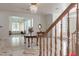 Elegant foyer with marble flooring, a chandelier, and staircase with wooden railing at 56 Quail Run Rd, Henderson, NV 89014