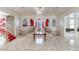 Spacious foyer boasts marble floors, a crystal chandelier, and a staircase with red carpet at 56 Quail Run Rd, Henderson, NV 89014