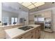 A kitchen with stainless steel appliances, gas cooktop, and light wood cabinetry at 56 Quail Run Rd, Henderson, NV 89014
