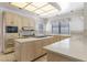 Kitchen featuring stainless steel appliances, gas cooktop, and light wood cabinetry at 56 Quail Run Rd, Henderson, NV 89014