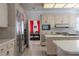 Bright eat-in kitchen featuring stainless steel appliances and light cabinetry at 56 Quail Run Rd, Henderson, NV 89014