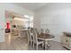 Open concept kitchen and dining area with neutral tones and lots of natural light at 56 Quail Run Rd, Henderson, NV 89014
