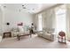 Bright living room featuring plush seating, elegant curtains, and recessed lighting at 56 Quail Run Rd, Henderson, NV 89014