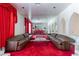Living room featuring sofas, mirrors, and bright red carpeting at 56 Quail Run Rd, Henderson, NV 89014