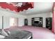 Spacious main bedroom with unique ceiling detail, TV, and ample storage space at 56 Quail Run Rd, Henderson, NV 89014