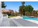 Pool and garden area with verdant greenery, landscaping, and serene views at 56 Quail Run Rd, Henderson, NV 89014