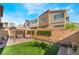 Beautiful backyard oasis with cozy seating under a covered patio and artificial turf, perfect for outdoor enjoyment at 6141 May River St, Las Vegas, NV 89148