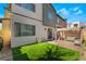 Private backyard with a covered patio and artificial grass perfect for relaxation and entertaining at 6141 May River St, Las Vegas, NV 89148